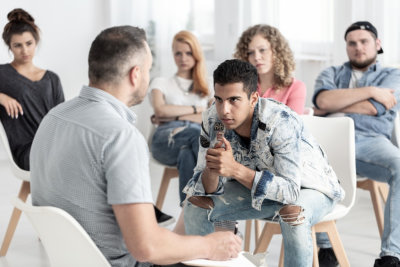 young man talking to a therapist