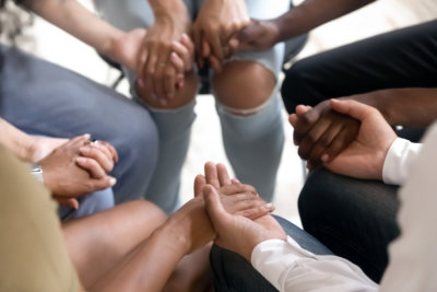 group of people holding hands