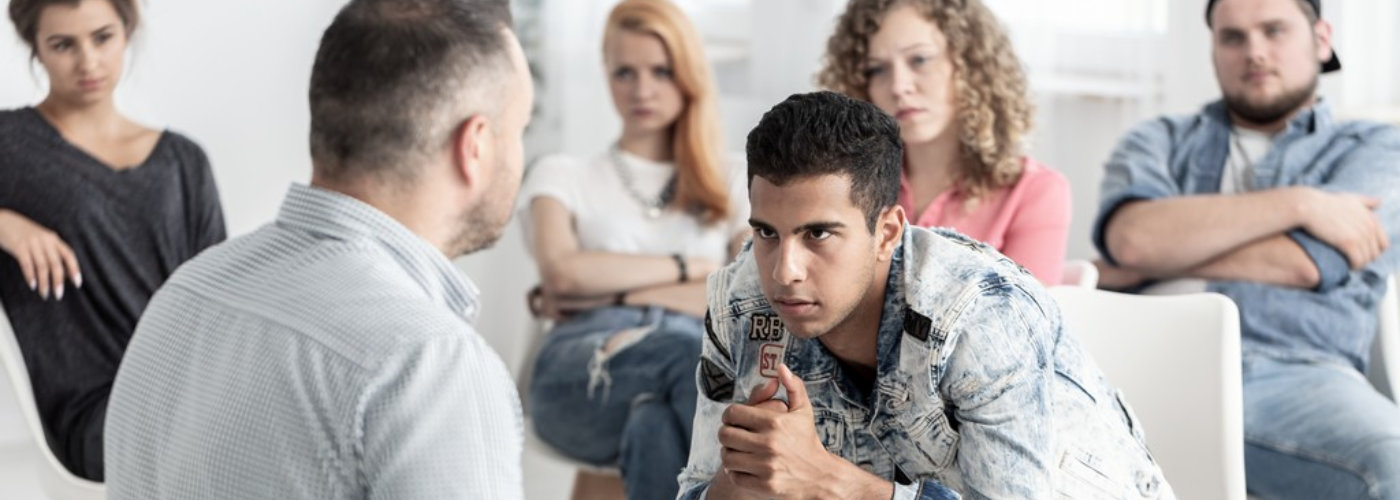 young man talking to a therapist